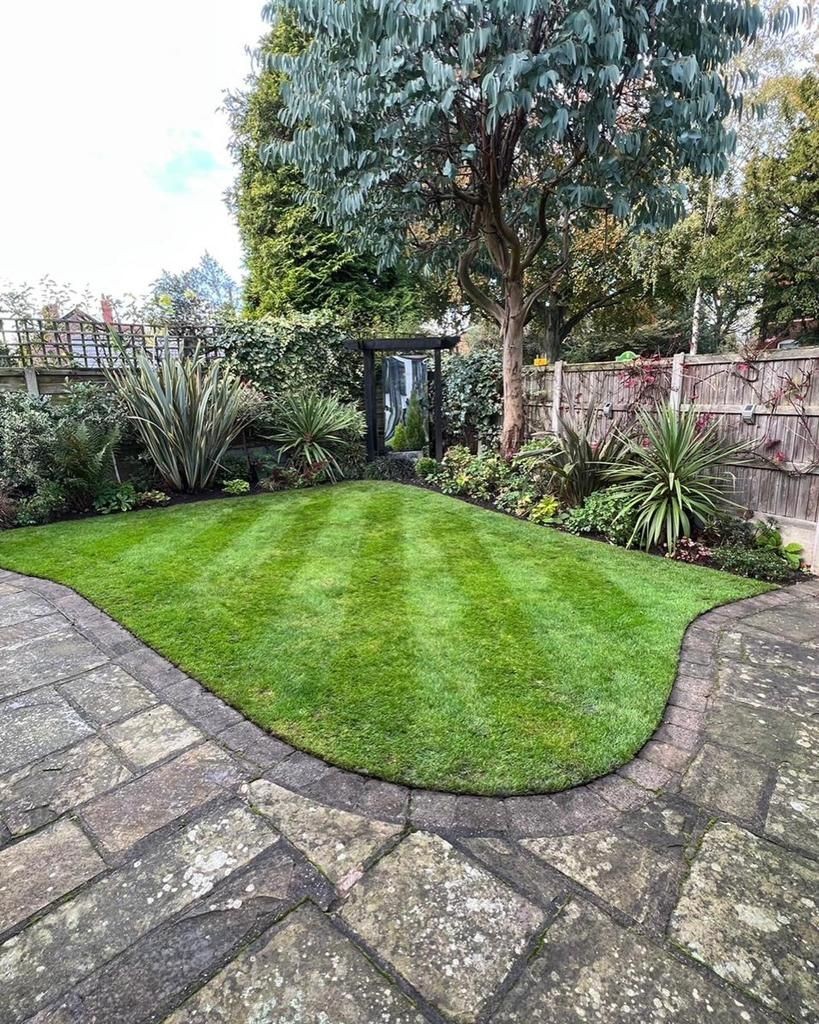 Expert garden maintenance in Altrincham, Cheshire. Our skilled team at Hassell Tree ensures a pristine garden environment. A professional gardener using precision tools to manicure and enhance outdoor spaces.